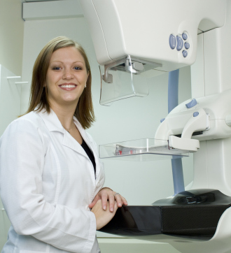 Woman doctor with mammography machine